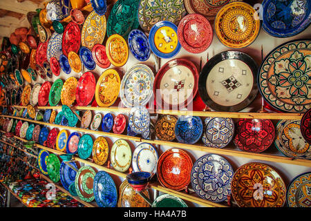 Beautiful arabic colorful hand made pottery bowls on display in the market in Morocco Stock Photo