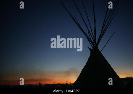 November 25, 2016 - Cannon Ball, North Dakota, U.S - A yurt is silhouetted as the sun rises at the Oceti Sakowin Camp at the Standing Rock Indian Reservation in Cannon Ball, North Dakota. (Credit Image: © Joel Angel Juâ€¡Rez via ZUMA Wire) Stock Photo