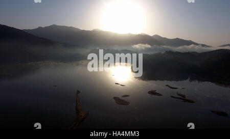 Yixian. 28th Nov, 2016. Photo taken on Nov. 28, 2016 shows fog-enveloped Qishu Lake in Yixian County of Huangshan City, east China's Anhui Province. Credit:  Chen Yehua/Xinhua/Alamy Live News Stock Photo