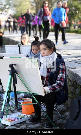 Yixian, China's Anhui Province. 28th Nov, 2016. Students paint at Hongcun Village of Yixian County, east China's Anhui Province, Nov. 28, 2016. Credit:  Chen Yehua/Xinhua/Alamy Live News Stock Photo