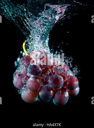 Fresh grape in water with air bubbles Stock Photo