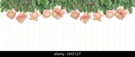 Christmas tree branches and gift boxes. Holidays banner. Flat lay Stock Photo
