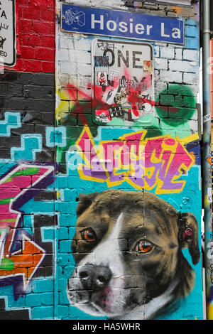 Colorful graffiti artwork in Hosier Lane with road name street sign Stock Photo