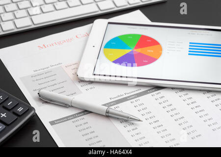 Tablet computer on desk in office, investment, data Stock Photo