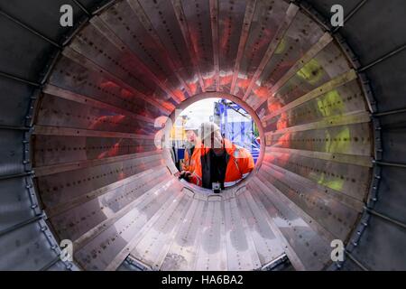Workers inspect the inside of an ultra-powerful Â£10 million magnetic ...