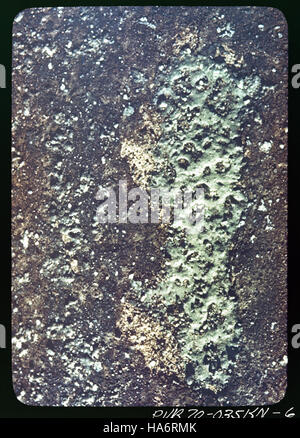 This image of trinitite, found at the Trinity Site in September 1945, shows a close-up of the green glass formed from the first nuclear test. The glass formed due to the intense heat of the atomic explosion, symbolizing a key moment in history during the development of nuclear weapons. Stock Photo