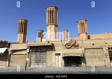 Building with badgirs - wind towers used as a natural air-conditioning system, Yazd, Iran. Stock Photo