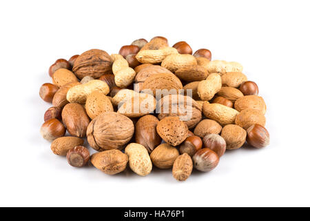 Mixed nuts in shells on a white background Stock Photo