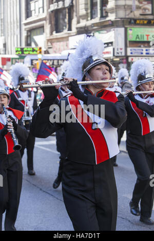 Veterans Day Parade; also known as America's Parade; marches up 5th Avenue in New York City. High school marching bands from around the country march. Stock Photo