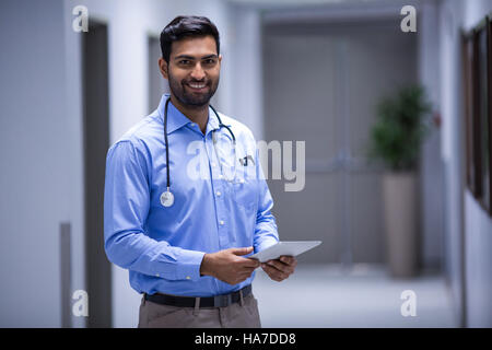 Doctor using digital tablet Stock Photo