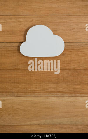 Cloud paper on wooden plank Stock Photo