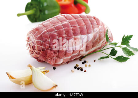 Rolled pork roast, raw with ingredients Stock Photo