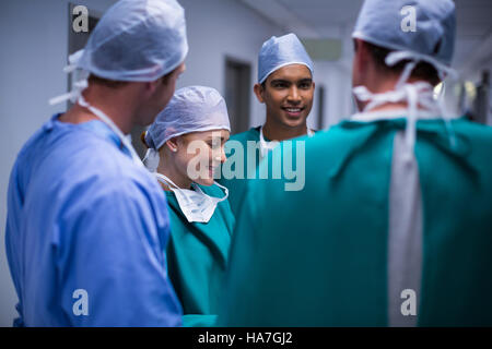 Surgeons having discussion in corridor Stock Photo