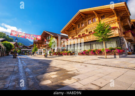 Old city center of Gstaad village - famous ski resort in Swiss Alps, Switzerland. Stock Photo