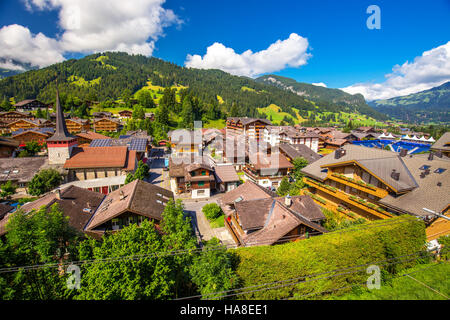 Old city center of Gstaad town in Swiss Alps, famous ski resort in canton Bern, Switzerland. Stock Photo