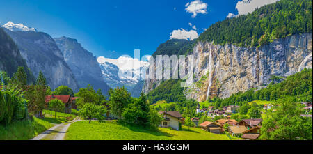 Famous Lauterbrunnen valley with gorgeous waterfall and Swiss Alps in the background, Berner Oberland, Switzerland, Europe. Stock Photo