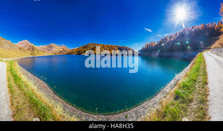 View of lake Ritom in Piora, Canton Ticino of Switzerland with Swiss Alps in the background, Switzerland, Europe. Stock Photo