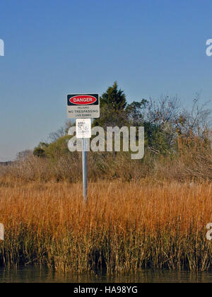 Safety guidelines sign warning visitors to watch for wild animals in ...