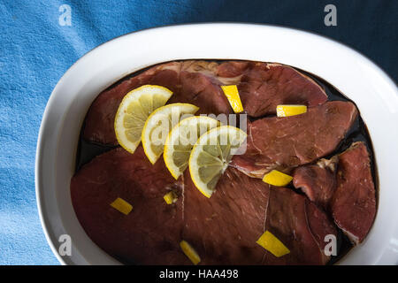 Beef marinating in a dish Stock Photo