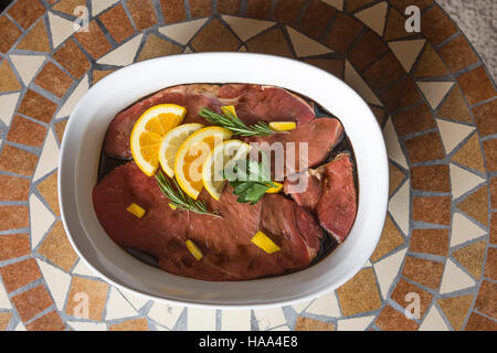 Beef marinating in a dish Stock Photo