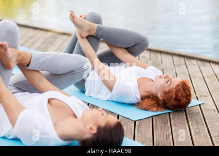 Woman working out at home, doing yoga exercise on floor, lying in Eye of  the Needle hip stretch pose Dead or Reclining Pigeon posture resting after  practice. Flat vector illustration isolated 8324436