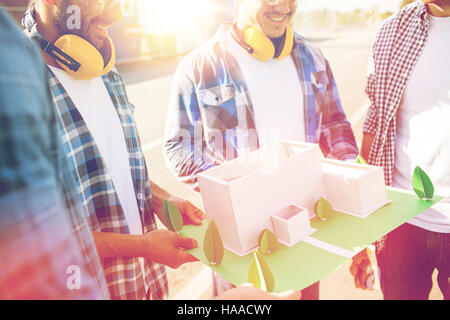 close up of builders with paper house model Stock Photo