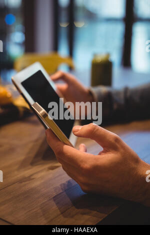 Man using digital tablet and mobile phone Stock Photo
