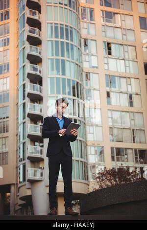 Businessman using digital tablet Stock Photo