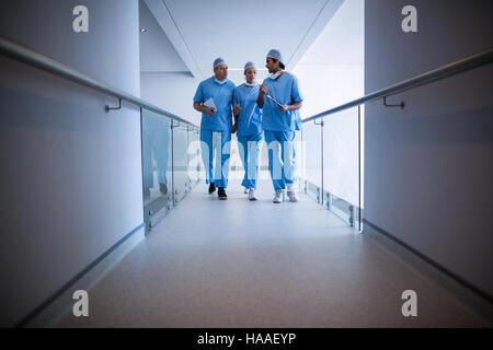 Surgeons interacting with each other Stock Photo