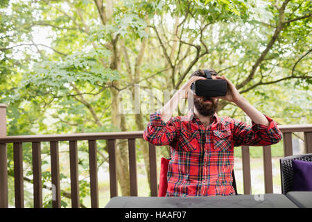Man using virtual reality headset Stock Photo
