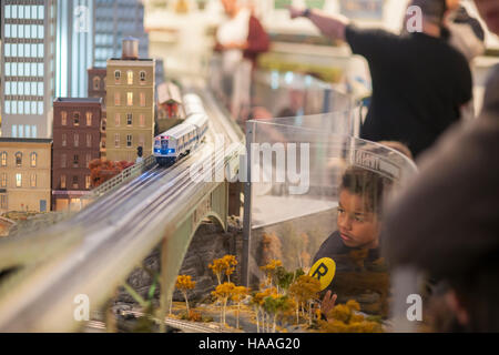 Visitors to the New York City Transit Museum in Grand Central Terminal in New York on Sunday, November 20, 2016 enjoy the 15th Annual Holiday Train Show. Lionel trains depart and arrive at Grand Central Terminal and travel around New York in miniature at the show which runs until February 26, 2017.  (© Richard B. Levine) Stock Photo