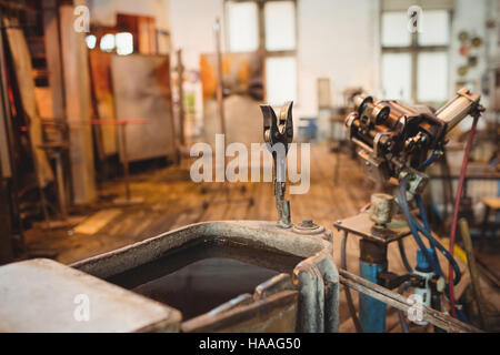 Empty workstation at glassblowing factory Stock Photo