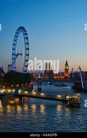 The London Eye and Westminster at dusk, with Festival pier on the Thames Stock Photo