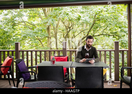 Man using digital tablet Stock Photo