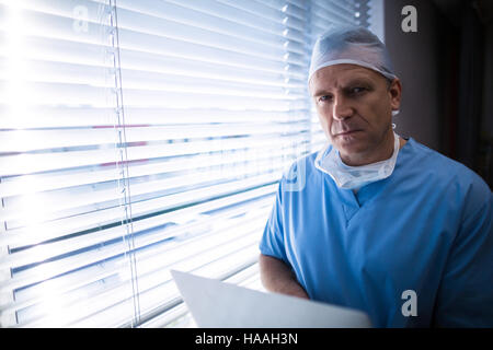 Surgeon using laptop Stock Photo