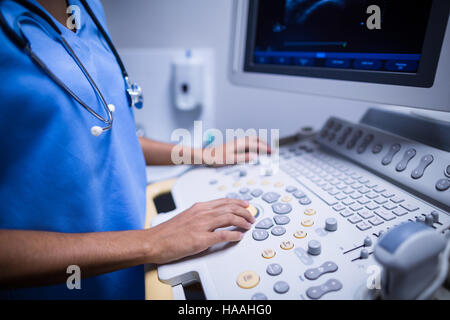 Nurse using ultrasonic device Stock Photo