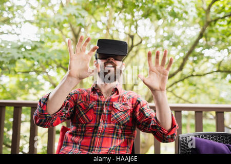 Man using virtual reality headset Stock Photo