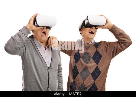 Excited seniors using VR headsets isolated on white background Stock Photo