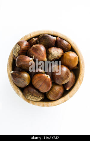 Chestnuts in a bowl isolated on white background Stock Photo