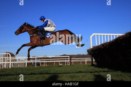 Agincourt Reef ridden by jockey Harry Teal jumps the last to win the The Breedon Aggregates Handicap Hurdle at Ludlow Racecourse. Stock Photo