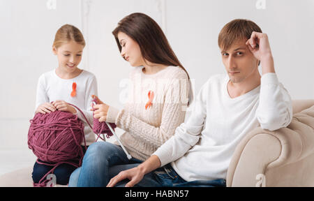 Nice good looking woman holding knitting needles Stock Photo