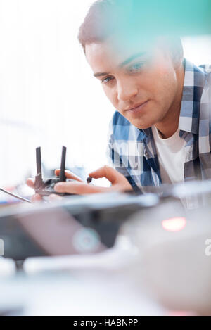 Handsome man testing the drone and remote controller Stock Photo