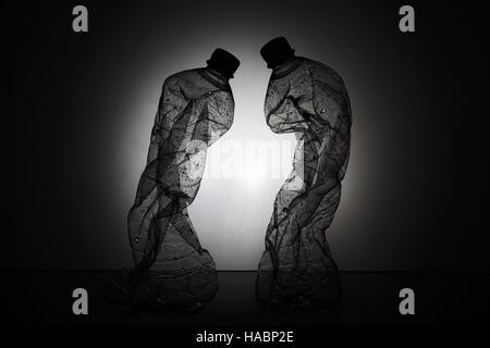 Two Crumpled Plastic Bottles Silhouette Stock Photo
