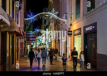 People walking at Christmas night streets of Santa Cruz town on Tenerife island, Spain Stock Photo