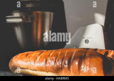 milk bread on a plate in front of a food processor Stock Photo