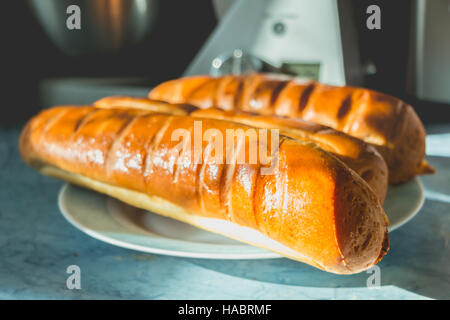 milk bread on a plate in front of a food processor Stock Photo
