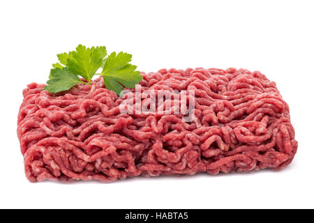 raw minced meat with garnish on a white isolated background Stock Photo