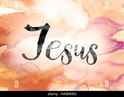 The word 'Jesus' painted in black ink over a colorful watercolor washed background concept and theme. Stock Photo