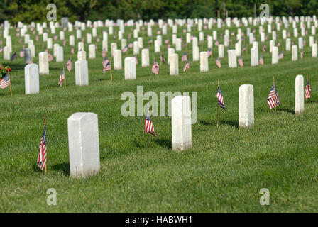 Fort Myer, Virginia, USA - May 1, 2015: American flags honor veterans buried at Arlington National Cemetery at Fort Myer near Washington, D.C. Stock Photo