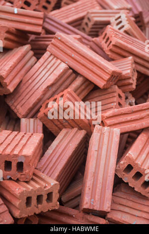 Orange heap bricks for construction Stock Photo